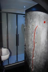 a bathroom with a toilet and a sink and a door at Domus31 - Luxury House in Trastevere in Rome +62 photos