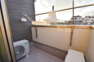 a balcony with a fan and a window at FINOA Residential Suite Asakusa/Oshiage Skytree in Tokyo