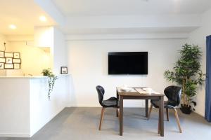 TV a/nebo společenská místnost v ubytování The Grand Residence Hotel Hakata