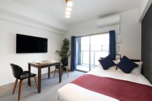 TV a/nebo společenská místnost v ubytování The Grand Residence Hotel Hakata