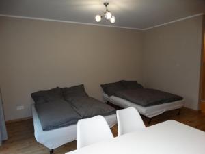 Łóżko lub łóżka w pokoju w obiekcie Apartamenty Miku