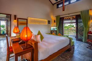 Voodi või voodid majutusasutuse Hoi An Chic - Green Retreat toas