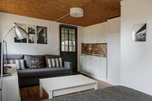 a living room with a couch and a table at Camping Giralda in Huelva