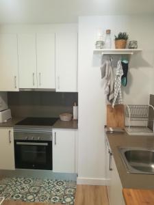 Kuchyňa alebo kuchynka v ubytovaní Apartment IBIZA STYLE