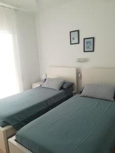 Posteľ alebo postele v izbe v ubytovaní Apartment IBIZA STYLE