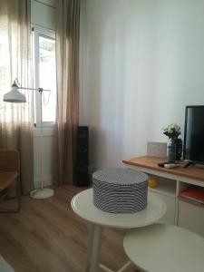 Televízia a/alebo spoločenská miestnosť v ubytovaní Apartment IBIZA STYLE