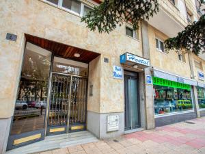 a store front of a building on a city street at Hostal Mindanao in Salamanca +42 photos