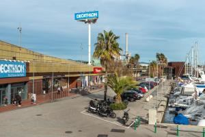 a marina with motorcycles parked in a parking lot at Boat Hotel Barcelona in Barcelona