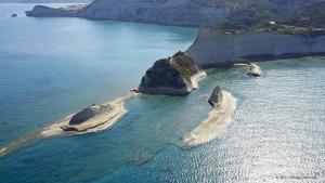 an aerial view of an island in the ocean at Takis Apartments in Sidari