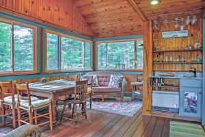 a dining room with a table and chairs in a cabin at Waterfront Denmark Complex with Dock on 12 Acres! in Denmark