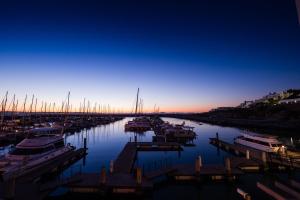 a group of boats docked in a marina at night at Club Mykonos Langebaan in Langebaan