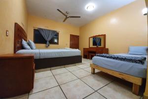 Postel nebo postele na pokoji v ubytování Hotel Colonos Los Cabos
