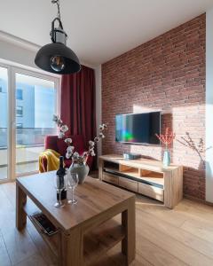 Televízia a/alebo spoločenská miestnosť v ubytovaní P&O Serviced Apartments Group Komputerowa