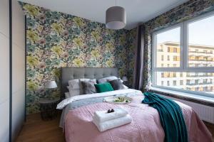 Posteľ alebo postele v izbe v ubytovaní P&O Serviced Apartments Group Komputerowa