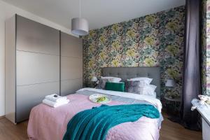 Posteľ alebo postele v izbe v ubytovaní P&O Serviced Apartments Group Komputerowa