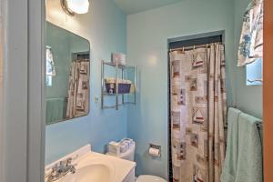 a bathroom with a sink and a toilet and a mirror at Catalina Mtn Views, BBQ Ready Cozy Tucson House in Tucson +16 photos