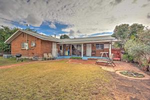 a brick house with a patio and a yard at Catalina Mtn Views, BBQ Ready Cozy Tucson House in Tucson