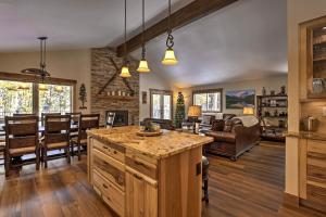 a kitchen and living room with a table and chairs at Keystone Home on Snake River with Hot Tub and Views! in Keystone