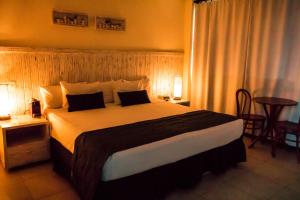 Postel nebo postele na pokoji v ubytování Farol de Itapuã Praia Hotel