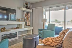 a living room with a couch and chairs and a tv at Gorgeous Litchfield Oasis about 6 Mi to Luke AFB in Litchfield Park