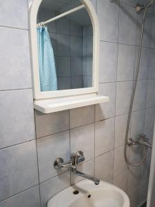 a bathroom with a sink and a mirror at Tiny House Veronia in Ohrid +11 photos