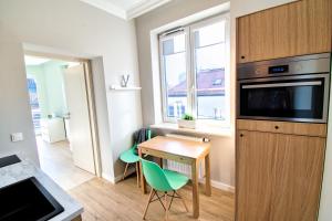 Kuchyňa alebo kuchynka v ubytovaní City Life Apartments Kraków