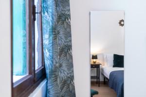 Postel nebo postele na pokoji v ubytování Haus Ormesini