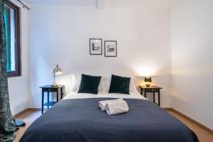 Postel nebo postele na pokoji v ubytování Haus Ormesini