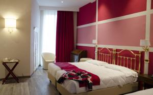 Voodi või voodid majutusasutuse Hotel Settentrionale Esplanade toas