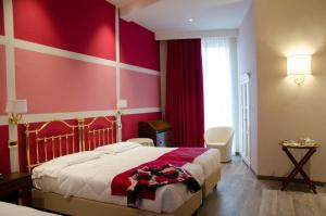 Voodi või voodid majutusasutuse Hotel Settentrionale Esplanade toas