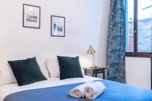 Postel nebo postele na pokoji v ubytování Haus Ormesini