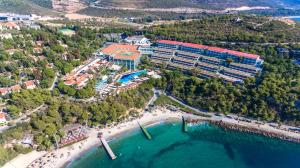 an aerial view of a resort and a beach at Pine Bay Holiday Resort in Kuşadası