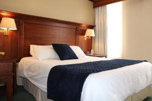 Postel nebo postele na pokoji v ubytování Hotel Florida