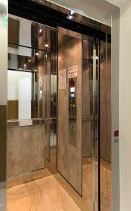 an elevator in a building with its door open at Hotel Ideon in Chania