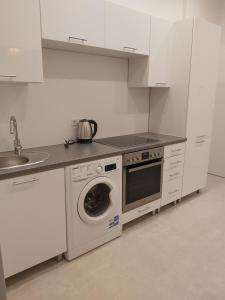 Kuchyň nebo kuchyňský kout v ubytování Angelika Apartments
