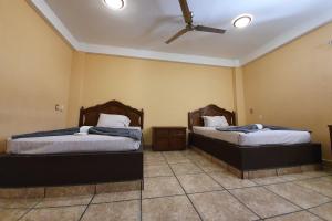 Postel nebo postele na pokoji v ubytování Hotel Colonos Los Cabos