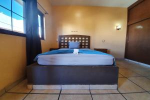 Postel nebo postele na pokoji v ubytování Hotel Colonos Los Cabos