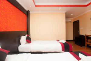 Voodi või voodid majutusasutuse Kathmandu Regency Hotel toas