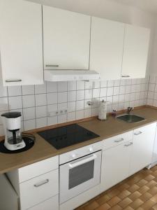 Virtuvė arba virtuvėlė apgyvendinimo įstaigoje Ferienwohnung An der Gildenstr. 2