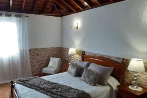 A bed or beds in a room at CASA DE LA CRUZ