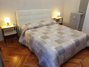 A bed or beds in a room at Appartamento Rosalba