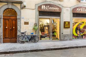 a bike parked on a sidewalk in front of a store at Florence City Center Flat Via Dei Neri in Florence