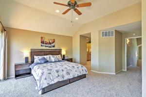 a bedroom with a bed and a ceiling fan at Waterfront Discovery Bay Home with Outdoor Bar and Dock in Discovery Bay