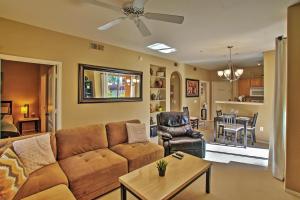 a living room with a couch and a table at Phoenix Abode Pool Access, Near Bellair Golf Club in Phoenix