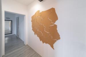 a wall art of a map on a wall at Around the World Vision Apartment - Centrum in Opole
