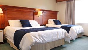 Postel nebo postele na pokoji v ubytování Hotel Florida