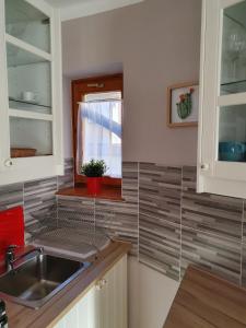 Kuchyň nebo kuchyňský kout v ubytování Pannonia Apartman