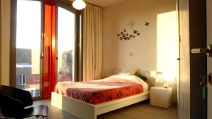 Katil atau katil-katil dalam bilik di PLANT BASED b&b central Bruges