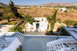 a view of a villa from the balcony of a house at Agnanti Studios in Naousa