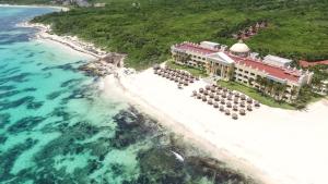 an aerial view of a resort on a beach at Iberostar Grand Paraiso in Puerto Morelos